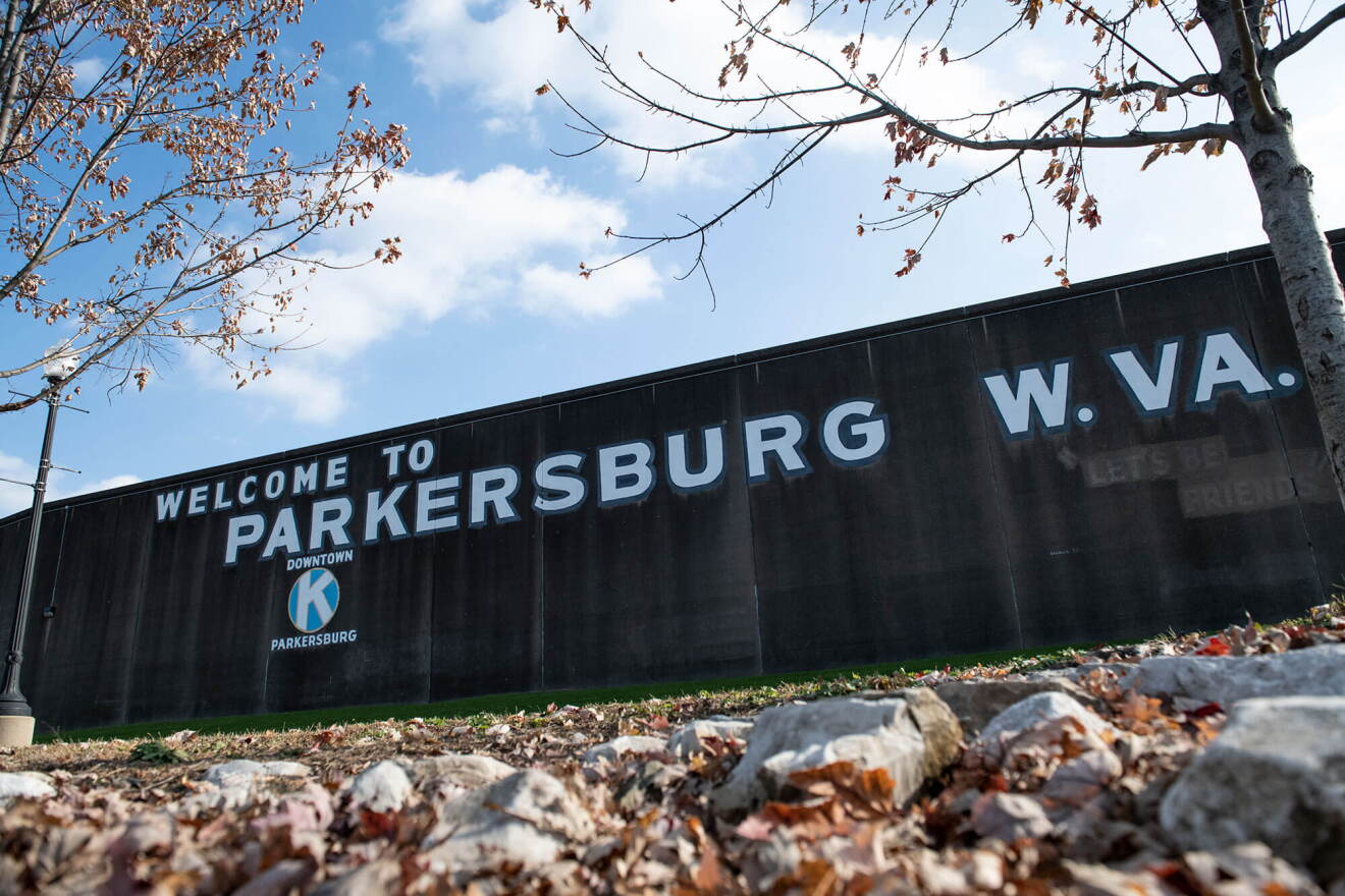 Weathered signage on the Point Park floodwall greets passersby in downtown Parkersburg, West Virginia, on Nov. 20, 2019.